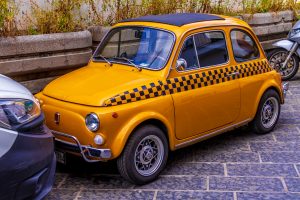 yellow fiat 500 in Italy travel in Italy by car