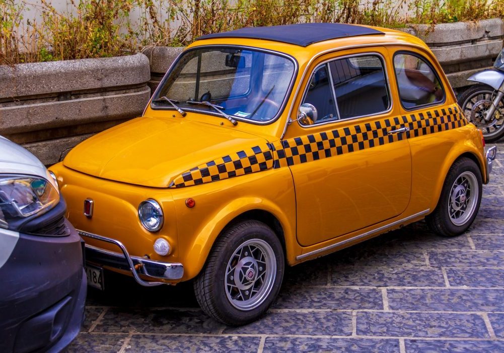 yellow fiat 500 in Italy travel in Italy by car